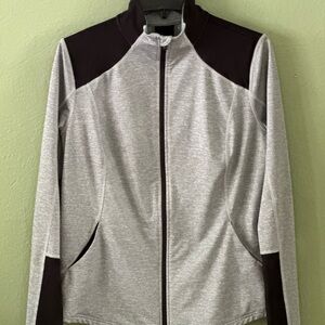 Stretchy jersey jacket; no labels or care instructions.